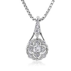 This is part of Chairish’s Fine Jewelry assortment.  Introducing the exquisite Art Deco Floral Diamond Pendant Necklace—a true embodiment of timeless elegance and sophistication. Crafted with meticulous attention to detail, this captivating piece showcases a dazzling 0.55 carat diamond set in a lustrous 18-karat white gold setting. The pendant's design draws inspiration from the Art Deco era, characterized by its geometric patterns and intricate motifs. The centerpiece of this necklace features a brilliant round-cut old European diamond, meticulously chosen for its exceptional clarity and radiance. The diamond's facets are expertly cut to maximize its brilliance, reflecting light from every angle and creating a mesmerizing play of sparkle. One Old European center diamonds weighing 0.20 car Elegant Teardrop Pendant Diamond Necklace For Anniversary, Elegant White Gold Teardrop Pendant Diamond Necklace, Formal Bridal Necklace In Platinum White Gold, Luxury Oval Bridal Necklace, Formal Bridal Necklace In White Gold-colored Platinum, Formal White Gold Platinum Bridal Necklace, Exquisite Platinum Necklace With Single Cut Diamonds, Exquisite Diamond Necklace For Formal Occasions, Elegant Teardrop Pendant Necklace With Brilliant Cut