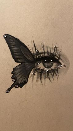 an eye with long lashes and black wings on it's side, drawn in pencil