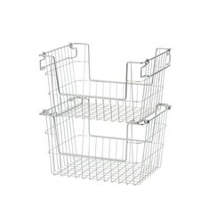 two wire baskets are stacked on top of each other, one is white and the other is silver