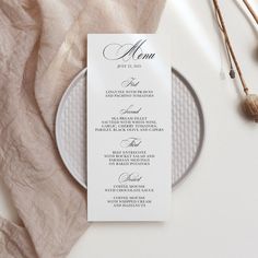 a menu card sitting on top of a plate