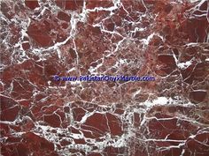 red marble with white streaks on it