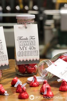 two jars filled with candy sitting on top of a table