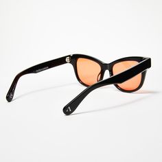 Our HELIX frames, LEOIDE's signature orange lens sunglasses, are the ultimate style statement for your daily adventures. These unisex designer shades combine the boldness of orange lenses with a timeless grunge-inspired aesthetic. Crafted with precision from premium 100% Mazzucchelli Acetate The HELIX orange lens sunglasses are vintage-inspired, taking on an approachable, yet statement choice. Cat Eye Sunglasses With Gradient Lenses For Streetwear, Streetwear Cat Eye Sunglasses With Gradient Lenses, Modern Orange Wayfarer Sunglasses, Modern Orange Cat Eye Sunglasses With Mirrored Lenses, Orange Wayfarer Sunglasses With Anti-reflective Coating, Orange Polarized Wayfarer Sunglasses, Orange Wayfarer Sunglasses With Polarized Lenses, Orange Lens Sunglasses, Gender Neutral Style