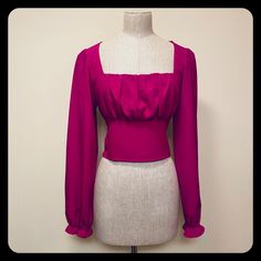 This Beautiful Magenta Blouse Has A Square Neckline And Peasant Sleeves That Are Cinched At The Wrists. It Is Shirred In The Back For A Perfect Fit. It Measures 17” From Armpit To Armpit And 17” From The Top Of The Shoulder To The Bottom Hem. 94% Polyester, 4% Spandex. Fitted Square Neck Blouse For Night Out, Fitted Padded Blouse For Date Night, Cropped Blouse For Fall Date Night, Cropped Blouse For Date Night In Fall, Fitted Crop Top Blouse For Date Night, Fall Party Blouse With Square Neck, Square Neck Padded Blouse For Party, Padded Square Neck Blouse For Party, Trendy Fitted Blouse For Date Night