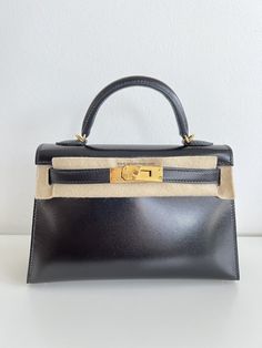 Hermès Mini Kelly Black Box With Gold Hardware - AG Concierge Fzco Mini Kelly, Aesthetic Bags, Leather Box, Hermes Bags, Black Box, Retail Therapy, Black Bag, Gold Leather, Full Set