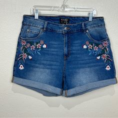 These Nwt Shorts Have A Floral Embroidery On The Front, Rolled Hem, And 5 Pockets. The Waistband Has Stretch So It Will Conform To Your Waist As You Move. They Are A Size 16, Which Should Fit Like A 1x According To The Size Guide But Please Be Sure To Double Check The Measurements In The Pictures To Ensure A Perfect Fit. Approximate Flat Waist: 17” Outseam: 15” Inseam: 4” Summer Floral Embroidery Medium Wash Bottoms, Summer Floral Embroidered Medium Wash Bottoms, Spring Denim Blue Shorts With Floral Embroidery, Embroidered Medium Wash Bottoms For Summer, Embroidered Medium Wash Shorts For Spring, Embroidered Short Jeans For Spring, Summer Embroidered Medium Wash Bottoms, Embroidered Denim Jean Shorts For Summer, Blue Floral Embroidered Bottoms Short Length