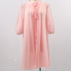 Elegant Vtg Airy Short Nightgown Robe. Soft Flowing Pink Fabric & Multiple Layers, Gathered 3/4 Long Sleeves. Bow & Snap Closure At Top. Vintage Fair Condition - Small Picks & 2 Small Holes That Get Lost In The Layers P6-9. Beautiful & Unique. Cotton Candy Halloween Costume? As-Is 1 Only. Tagless. Model 4. Fits Os. Buy M! Flat~ 17 Sl 35 L Relax Everyday Quarantine Leisure Romantic Sexy Lingerie Intimates Girly Luxury Gathered Ruffle Soft Vintage Hostess 60s Airy Sheer Peignoir Angelic Pink Sheer Lounge Dress, Pink Sheer Loungewear Dress, Pink Sheer Dresses For Loungewear, Vintage Pink Sleepwear, Vintage Pink Nightgown For Spring, Vintage Pink Sleep Dresses, Pink Vintage Sleep Dress, Vintage Sheer Dresses For Bedtime, Vintage Pink Sleepwear For Bedtime