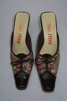 "Miu Miu A/W 1999 Holographic Mule Runway Collection. Holographic print changes with the light. marked size: 35 IT  fits: US 4.5/5 (fits narrow) length: 8.5\" condition: Excellent vintage condition.   All sales are final. Please note that signs of wear are normal for vintage and pre-loved items. All items have been hand-picked by LAV and are in top vintage condition." Vintage Mui Mui, Y2k Holographic, Holographic Shirt, Holographic Boots, Holographic Purse, Holographic Jacket, Holographic Dress, Holographic Heels, Vintage Miu Miu