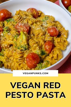 vegan red pesto pasta with tomatoes and broccoli in a white bowl