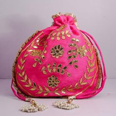 Traditional India Handcrafted Gota Patti Work Potli Bag Golden Lace Embroidered Handbag For Wedding Bridal BagMaterial:Golden Lace, Silk Fabric, Golden Thread, MotifsColor: Red, Pink, Gazri, Navy BluePackage Contents: As per quantity purchasedSize: 10" x 8"Designed with the heart, this beautiful Potli or batawa bag are eye catchy and made of premium material.Key Features:Gota Patti WorkThis potli is good match with both Indian and western outfits and are superb for wedding and festive parties.Th Rectangular Shoulder Bag For Receptions And Festivals, Traditional Gold Embroidery Potli Bag, Multicolor Embroidery Zari Work Potli Bag For Festivals, Traditional Resham Embroidery Potli Bag For Festive Season, Festive Bags With Gold Embroidery For Gift, Festive Multicolor Embroidered Handwork Potli Bag, Elegant Pink Shoulder Bag For Festivals, Festive Dori Work Shoulder Bag, Traditional Gota Work Bag For Reception