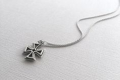 A beautiful Maltese Cross pendant in 925 sterling silver. This hand crafted cross is double sided and hangs from a beautiful, dainty chain. The entire necklace is made of 925 sterling silver with an antique finish to bring out the detailing and shine. This necklace is Nickel-Free and hypoallergenic. Material: 925 Sterling Silver Pendant Size: about 1 inch Chain Length: 16 inches *All purchases will arrive in a gift box! *Available in silver and in bronze *All orders are shipped via USPS First Cl Classic Sterling Silver Pendant Cross Necklace, Classic Silver Sterling Silver Cross Necklace, Classic Cross Necklace, Classic Sterling Silver Engraved Cross Necklace, Classic Engraved Sterling Silver Cross Necklace, Sterling Silver Necklace With Cross Pendant Stamped 925, Symbolic Sterling Silver Cross Necklace, Oxidized Cross Pendant Necklace As Gift, White Gold Cross Necklace With Oxidized Finish