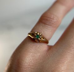 Such a beautiful piece! Solitaire emerald stone yellow gold ring. Preloved item Ring Size (approx.): 2.75 US Stamped 10KT gold Weight: 1.322g **FREE shipping within Canada and USA** If you have any questions or concerns, please do not hesitate to contact us. We will be more than happy to help you and answer any inquiries.  We invite you to check out our shop for more fabulous items! Antique Gold Round Emerald Ring, Antique Gold Emerald Ring, Yellow Gold Emerald Birthstone Open Ring, Gold Rings For May Birthstone, Gold Emerald Solitaire Birthstone Ring, Gold Solitaire Emerald Birthstone Ring, Yellow Gold Emerald Birthstone Ring For May, Emerald Yellow Gold Birthstone Ring For May, Yellow Gold Emerald Signet Ring Gift