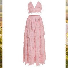 Field Of Dreams Collection The Briella Set Showcases A V-Cut Bustier With A Tiered A-Line Maxi Skirt. This Look Embraces A Feminine Touch With Its Baby Pink Hue And Poplin Lace Fabric. The Briella Is The Perfect Two-Piece Set For Any Occasion. Alamour Styling Tip: Style This Look With Our Adele Pink Flower Pearl Studs. Worn Once For Pictures. Feminine Two-piece Spring Dresses, Feminine Two-piece Dresses For Spring, Feminine Two-piece Summer Dress, Elegant Pink Two-piece Dress For Spring, Chic Two-piece Wedding Dress, Chic Pink Two-piece Dress, Spring Wedding V-neck Sets, V-neck Wedding Sets For Spring, Sleeveless Lace Sets For Spring