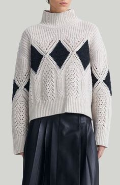 Featured on the fall 2024 runway, this chunky wool sweater displays the season's diamond motif amongst intricately knit gothic cabling and airy pointelle. Turtleneck Long sleeves 100% wool Dry clean Imported Designer Clothing Dior Knitwear, Pointelle Sweater, Ladies Turtleneck Sweaters, Knitwear Fashion, Design History, Knitwear Tops, Knit Fashion, Wool Sweater, Knitting Designs