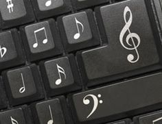 a keyboard with musical notes on the keys