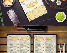 an overhead view of a restaurant menu with chopsticks and utensils on the table