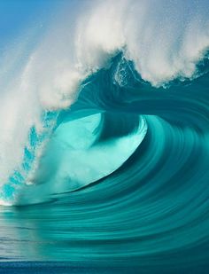 a large blue wave in the ocean