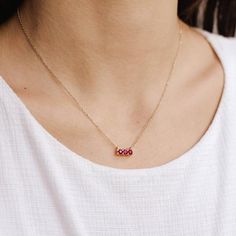 A beautiful Ruby bar necklace with 3 Rubies 3 mm each in 14K solid gold. This fine jewelry is nice for a Mother's DayDay gift! We offer more options in the drop down menu.PRODUCT DETAILS● Material: 14K solid gold - white gold - rose gold● Gemstones: Rubies natural● Gemstones Weight: 0.43ctHOW TO ORDER - CUSTOM ORDERS● Choose from the drop down menu the available options (Length, Material) and leave us a note for any special requirements.● For special orders forward us pictures of the design you Fine Jewelry Three Stone Necklace For Gift, Gold Three Stone Necklace As Gift, Gold Three Stone Necklace Gift, Gold Three Stone Necklace For Gift, Three Stone Gold Necklace As Gift, Bar Necklace Layered, Green Amethyst Ring, Stones Necklace, Necklace Layered