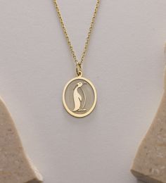 Gold Penguin life Pendant - Penguin Gold Necklace ● Material of pendant: Solid Gold 14k ( REAL GOLD ) ● Metal Stamp: 14k ( REAL GOLD ) ● The pendant is available in 5 sizes: - 12x17 mm / 0,47 x 0,66 inches - 13x18 mm / 0,51 x 0,70 inches  In the photos - 14x19 mm / 0,55 x 0,74 inches  - 16x21 mm / 0,62 x 0,82 inches  - 18x24 mm / 0,70 x 0,94 inches ( In the photos the size is 13x18 mm / 0,51 x 0,70 inches ) ( Jump Ring inner diameter: 4 mm ) ● Material of chain: Solid gold 14k ( REAL GOLD ) It is thin and dainty and it is available in 4 sizes: - 40 cm / 15,75 inches ( Length ) - 45 cm / 17,72 inches ( Length ) In the photos - 50 cm / 19,68 inches ( Length ) - 55 cm / 21,65 inches ( Length ) ● Backside engraving is FREE ( Please use the personalization box for that.) ● If you want larger si Silver Charm Necklace Stamped 14k As Gift, Gift Silver Charm Necklace Stamped 14k, Yellow Gold Charm Necklace As A Gift, Yellow Gold Oval Charm Necklace As Gift, Yellow Gold Oval Charm Necklace Gift, Gold Charm Necklace As A Gift With Polished Finish, Gold Charm Necklaces With Polished Finish For Gift, Gold Polished Finish Charm Necklace As Gift, Gold Polished Finish Charm Necklace For Gift