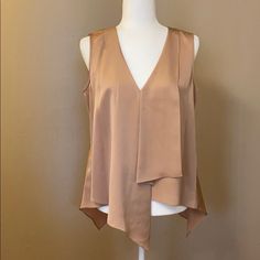 Nwt Bcbgmaxazria “Bianca” Sleeveless Blouse In Color Maple. Beautiful Neutral Tan Color. Size Small. No Damage. Never Worn/Used. Excellent Condition! Reference: Mannequin Is A Size 6. Spring Formal Camisole Top, Formal Spring Camisole Top, Silk Sleeveless Tank Top For Spring, Chic Formal Tank Top For Spring, Elegant Tank Vest For Night Out, Chic Formal Spring Tank Top, Spring Evening Vest In Sleeveless Blouse Style, Chic Tank Vest For Layering, Elegant Evening Tank Vest