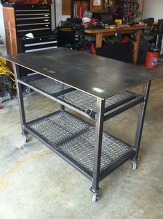 a metal workbench in a garage with tools on the table and shelves behind it