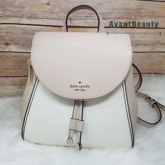 Name - Kate Spade Medium Flap Backpack Warm Beige White `` Price Is Firm `` More Details - 9.5"H X 9.25"W X 4.75"D Handle Drop: 2" Pebbled Leather + Bag Is Authentic ++ From Smoke Free & Pet Free Home +++ No Trades ++++ Check Out My Other Listings I Have Available From Avantbeautybags Photos Are Taken With Bright Lighting And Colors May Vary Under Different Conditions (Your Device, Monitor, Etc). White Leather Satchel Backpack, Luxury White Leather Backpack With Adjustable Strap, Luxury White Backpack With Detachable Strap, White Leather Shoulder Backpack, White Leather Backpack With Dust Bag, Elegant Kate Spade Leather Backpack With Detachable Strap, Elegant Kate Spade Leather Satchel Backpack, White Luxury Leather Backpack For Daily Use, Luxury White Leather Backpack For Daily Use