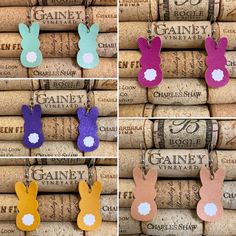 four different colors of bunny ears hanging from corks with wine corks in the background