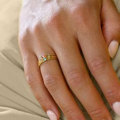 The Personalized Family Birthstones Stackable Ring in Stainless Steel is an innovative celebration of family and motherhood. Comprising a series of stackable bands in a diverse array of colors, each ring holds a single gemstone, representing the birth month of a loved one. Designed for versatility and personal expression, these rings can be worn stacked together or individually, allowing a mother to carry a symbol of her family's unity and her unique bond with each member. This set is an outstan Stacked Midi Rings As A Gift, Adjustable Stackable Birthstone Ring For Mother's Day, Adjustable Hypoallergenic Fine Jewelry Stackable Rings, Adjustable Hypoallergenic Stackable Fine Jewelry Rings, Modern Stacked Rings For Gifts, Modern Stacked Rings As Gift, Mother's Day Stackable Ring Jewelry, Adjustable Rainbow Stackable Jewelry, Adjustable Stackable Birthstone Rings Fine Jewelry