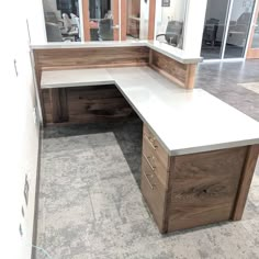 an office desk with two drawers and a bench