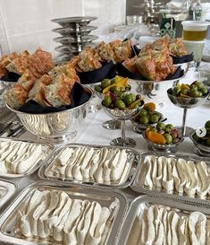 many trays of food on a buffet table