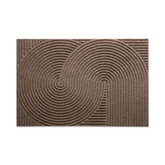 a brown door mat with spiral design on the front and back side, in two different colors