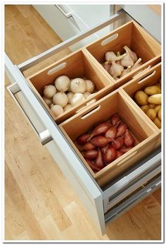 the drawers are filled with different types of vegetables