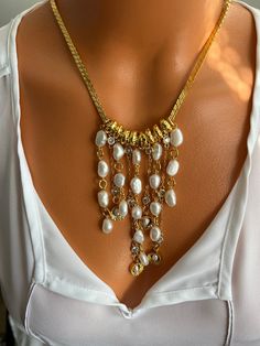 🤗 The necklace I made will make a worthy addition to your collection and will leave you spellbound while pair this casual jewel with a nice pair of earrings to complete your look ! A perfect anniversary or another speacial holiday or ocasion gift 🙏 ✔️The materials I've used for necklace are gold filled brass chain snake style , 7-8 mm size irregular shape fresh water white pearls. The tiny multiple chains in front of the necklace are cubic zirconia chains, mixed with the pearl dangles rendering a fluent and attractive appearance. The necklace can be weared on occasions and parties as well due to its classic sport style . ❗ Feel free to contact me for item questions. Each item is individually wrapped in kraft jewelry gift box. If you want to add a gift note to the package, please leave a Vintage Pearl Chain Jewelry For Anniversary, Gold Pearl Necklace With Jewels As A Gift, White Dangle Necklace For Anniversary, Costume Jewelry Pearl Chain For Jewelry Making, Pearl Chain Necklace For Anniversary, White Jeweled Necklaces For Anniversary, Anniversary Pearl Chain Jewelry, White Chain Jewelry For Anniversary, Metal Dangle Necklaces For Anniversary