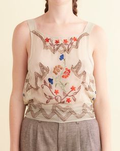 Embroidered Flower Study Top Elegant Spring Embroidered Top With Geometric Embroidery, Elegant Summer Tops With Geometric Embroidery, Embroidered Silk Tops For Summer, Elegant Floral Embellished Summer Tops, Elegant Floral Embellished Tops For Summer, Silk Summer Tops With Floral Embroidery, Spring Silk Blouse With Floral Embroidery, Chic Silk Blouse With Floral Embroidery, Elegant Silk Tops With Intricate Embroidery