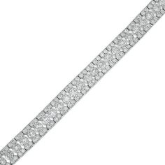 Your evening looks aren't complete without this exquisite diamond bracelet. Crafted in cool 10K white gold, this style showcases 1/20 ct. diamonds sparkling along the open-worked center. Diamond-lined borders complete this dazzling design. Stunning with 6 cts. t.w. of diamonds and a bright polished shine, this 7.0-inch bracelet secures with a tongue and groove clasp. Platinum Diamond Bracelet With Pave Setting In White Gold, Platinum Diamond Cut Bracelet In Diamond White, Platinum Diamond Bracelet With Round Cut Accents, Classic Platinum Bracelets With Pave Setting, Cubic Zirconia Diamond Bracelet With Pave Setting, Dazzling Diamond Tennis Bracelet With Pave Setting, White Diamond Tennis Bracelet With Pave Setting, Classic White Gold Diamond Bracelet With Pave Setting, Platinum Tennis Bracelet With Pave Setting For Formal Occasions