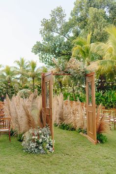 an outdoor wedding setup with chairs and flowers