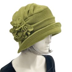 An original design, handmade with care in the USA and attention to detail.The Alice, a gorgeous winter cloche hat for women handmade in warm fleece. Inspired by both Downton Abbey and 1920's Style hats and given that modern-day twist.Accessorized with a fleece flower brooch.Unique, quality ladies hats handmade by Artist perfect for fall-winter and into spring headwear. A great gift For Hat lovers! Fleece is a great choice for a winter hat because it is so warm and comfortable. It also makes a gr Cappello Cloche, Bespoke Hats, Downton Abbey Fashion, Fleece Hat, Chemo Hat, Flapper Style, Fancy Hats, Hat Women, Stylish Hats