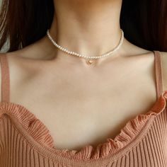 This pearl choker necklace is handcrafted with little freshwater pearls and a 14k gold filled puffy heart. The little pearls are handpicked to look perfect on women at any age. The heart and findings are made in 14k gold filled materials that won't get tarnished and are sensitive skin friendly. It is absolutely elegant on its own or layering it with other necklaces for a chic and modern look. Details Freshwater pearls measured 3.5mm-4mm. 14k gold filled materials. Extender chain of 2 inches available of your choice. Wanna browse more of my necklace series? https://www.etsy.com/ca/shop/PrettyPearlfect?section_id=31790396 Take a look at my shop to discover more pieces that are perfect for your jewelry collection: https://www.etsy.com/ca/shop/PrettyPearlfect Warranty We do understand that han Beaded Pearl Necklace For Valentine's Day, Dainty Pearl Necklace For Mother's Day, Heart-shaped Pearl Necklace, Delicate Heart-shaped Pearl Necklace, Pearl Necklace With Heart-shaped Beads, Dainty Pearl Choker With Round Beads, Dainty Pearl Necklace For Valentine's Day, Adjustable Pearl Necklace With Heart Beads, Dainty Pearl Necklace With Heart Beads