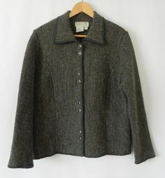 Denbigh Knit wear Sweater jacket                                                              . Material - 100% Wool                                     . Lining -   No                                     . Color –  Mixed Olive Green/ Brown tone                                     . Pattern – Textured                                     . Neck line – Collared                                     . Sleeve –   Long sleeve                                     . Closure – 8 Buttons Casual Long-sleeved Tweed Jacket With Button Closure, Casual Long Sleeve Tweed Jacket With Button Closure, Winter Button-up Tweed Jacket, Casual Tweed Button-up Jacket, Winter Tweed Jacket With Button Cuffs, Winter Long Sleeve Tweed Jacket With Button Cuffs, Winter Tweed Button-up Jacket With Button Cuffs, Winter Button-up Tweed Jacket With Button Cuffs, Classic Winter Outerwear With Functional Buttons