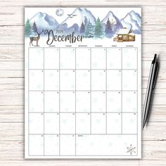 a calendar with the word december on it next to a cup of coffee and pen