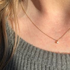 Introducing our TINY DEW DROP NECKLACE - the perfect piece for adding a subtle sparkle to any outfit. With a delicate and dainty necklace design, this piece features a tiny diamond that will catch the light just right and add a touch of elegance to your look. Trust our expertise in crafting high-quality, beautiful jewelry. 14k solid gold Dainty Diamond Drop Necklace With Delicate Chain, Dainty Birthstone Necklace With Single Diamond, Dainty Diamond Charm Necklaces, Delicate Diamond Drop Necklace With Delicate Chain, Delicate Everyday Diamond Charm Necklaces, Dainty Diamond Necklace With Accents, Dainty Diamond Necklace With Delicate Chain In Diamond White, Dainty Diamond White Necklace With Delicate Chain, Minimalist Birthstone Necklace With Diamond Accents