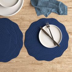 placemats and plates on a wooden table