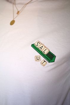 An original way to present yourself with this Scrabble t-shirt! To simply say hello or to write whatever you want, it's possible to customize it: for 5€ more, have the 5 letters of your choice embroidered and for 10€ more, you can add a letter! Machine embroidery on the chest, embroidered by me. Unisex tee. XS to 5XL. If you don't see your size, don't hesitate to ask me, maybe i have it in my stock! Tshirts are OEKO-TEK certified, meaning that the production contains no substance harmful to people or to the environment and take part in the FAIR WEAR FOUNDATION. Stitched T Shirt, Tshirt With Embroidery, See The Way I See, Back In Stock Graphic, T Shirt Embroidery Ideas, Embroidered Streetwear, Tee Embroidery, Tshirt Embroidery, T Shirt Embroidery