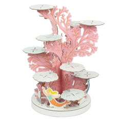 a pink and white tree with umbrellas in it's center, surrounded by water lilies