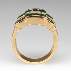 This colorful alternating wide band ring is accented with ten (10) round brilliant cut diamonds, and eighteen (18) square step cut natural emeralds set into channels. The ring measures 11.5mm at the top, rises 4.4mm above the finger, tapering to 4.7mm wide and 1.4mm thick at the base of the shank. The ring crrently fits a 5.5. Modern Green Diamond Anniversary Ring, Art Deco Green Emerald Multi-stone Ring, Formal Emerald Cut Ring With Single Cut Diamonds, Luxury Yellow Gold Emerald Ring With Square Cut, Elegant Yellow Gold Emerald Ring With Channel Set, Luxury Channel Set Emerald Ring For Anniversary, Luxury Formal Emerald Ring With Channel Set, Luxury Channel Set Emerald Ring For Formal Occasions, Elegant Green Channel-set Rings