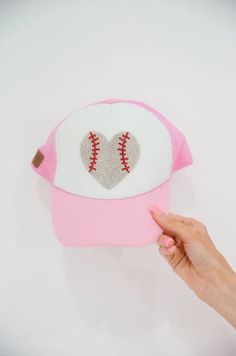 Hey Batter Hey! This one is for all the ballpark mini's, the MINI KIDS HEY BATTER TRUCKER HAT is perfect for your little one. Whether it's a long tournament day or a day spent watching your favorite team, this pink and white trucker hat will have your mini covered!

Trucker Hat Product details:

Snapback style
Ponytail opening 
Mesh in the back of hat
100% Polyester Fun Baseball Cap For Baseball Season, Fitted Cap For Baseball Season Game Day, Fitted Cap For Game Day During Baseball Season, One Size Trucker Hat For Baseball Season, Trucker Cap For Baseball Season, Baseball Season Snapback Hat For Fans, Pink Baseball Cap For Baseball Season, Baseball Season Snapback Hat For Game Day, Baseball Season Snapback Fitted Hat