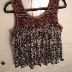 Black, Tan And White Loose Sleeveless Top Casual Brown Tank Vest, Brown Tank Vest Top, Brown Casual Sleeveless Tank Top, Casual Brown Sleeveless Tank Top, Brown Summer Vest Top, Brown Sleeveless Top For Spring, Brown Vest Top For Summer, Sleeveless Brown Cotton Top, Casual Brown Tank Top For Spring