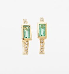 A bold gemstone, a lot of sparkle, and a whole lot of fun. These emerald earrings fit perfectly over your ears for a comfortable fit you can forget about all day. Wear as your everyday earring or for a little pop of color when you're headed out on the town. Easy wearing 24/7 earrings you never have to remember to take off.
Size: approximately 11mm Modern Emerald Cut Gemstone Earrings, Modern Yellow Gold Emerald Cut Earrings, Elegant Green 14k Gold Huggie Earrings, Modern Emerald Gemstone Earrings, Fine Jewelry Baguette Cut Emerald Earrings, Baguette Cut Emerald Earrings As A Gift, Modern Green 14k Gold Earrings, Gold Emerald Earrings, Baguette Earring