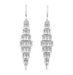 Exuding timeless luxury, this radiant pair of chandelier earrings features an impressive array of round brilliant and briolette cut diamonds totaling 19.83 carats. The dazzling stones artfully cascade in a lustrous 18K white gold setting. Sophisticated and elegant, these breathtaking chandelier earrings epitomize glamour. 3" length Diamond Chandelier, Diamond Chandelier Earrings, Expensive Jewelry, Round Brilliant, Chandelier Earrings, Diamond Jewelry, Diamond Cuts, White Gold, Stone