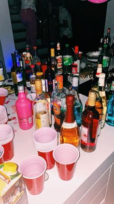 many different types of alcohol are on the counter